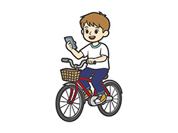 スマホを見ながら自転車に乗る少年